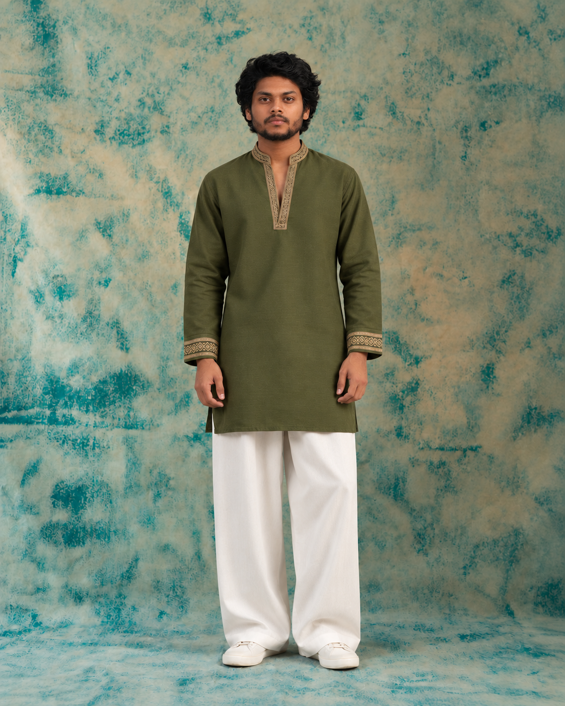 olive kurta against teal backdrop olive kurta against teal backdrop