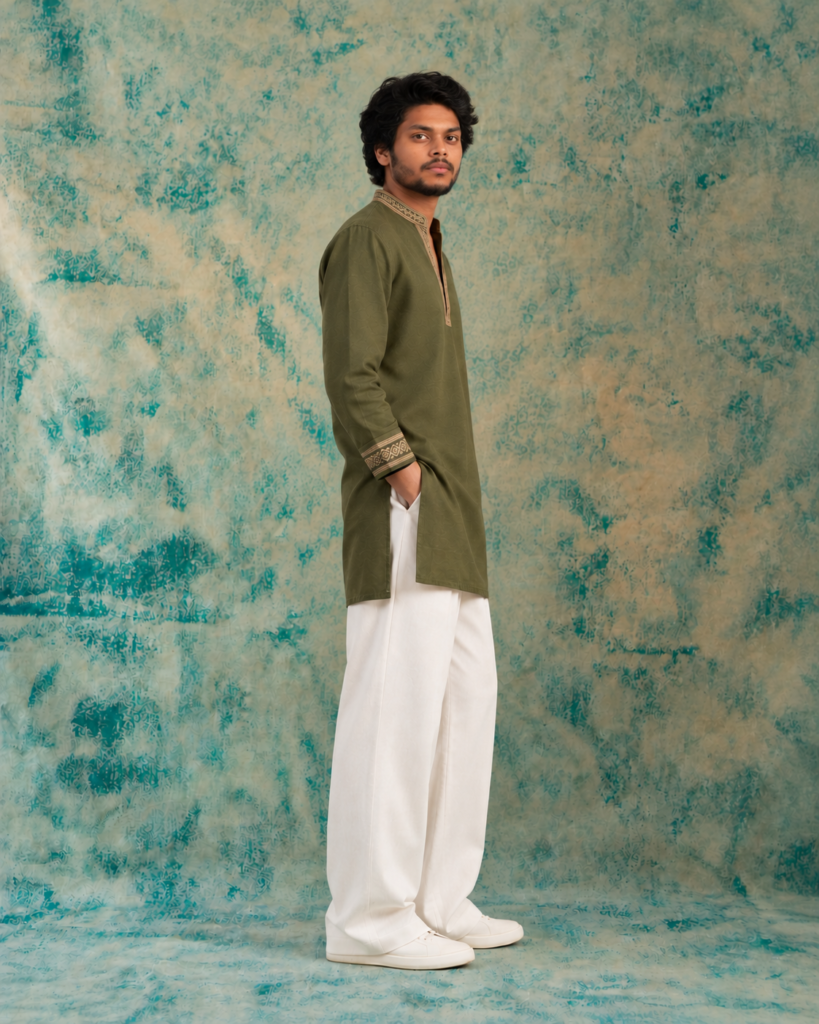 olive kurta against textured teal backdrop
