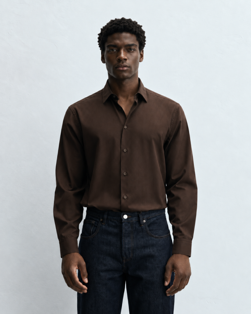 studio portrait in brown shirt and dark denim