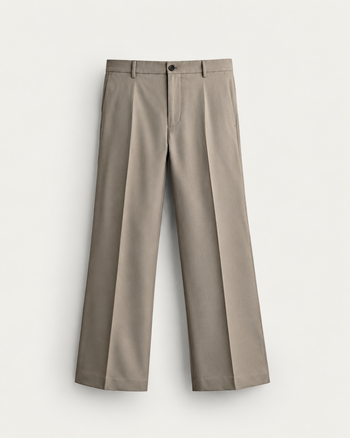 taupe tailored trousers on cream background taupe tailored trousers on cream background